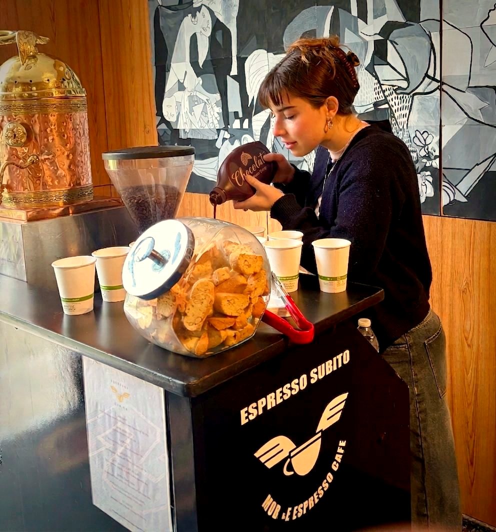 Danielle, an Espresso Subito barista, making drinks to order at the espresso bar