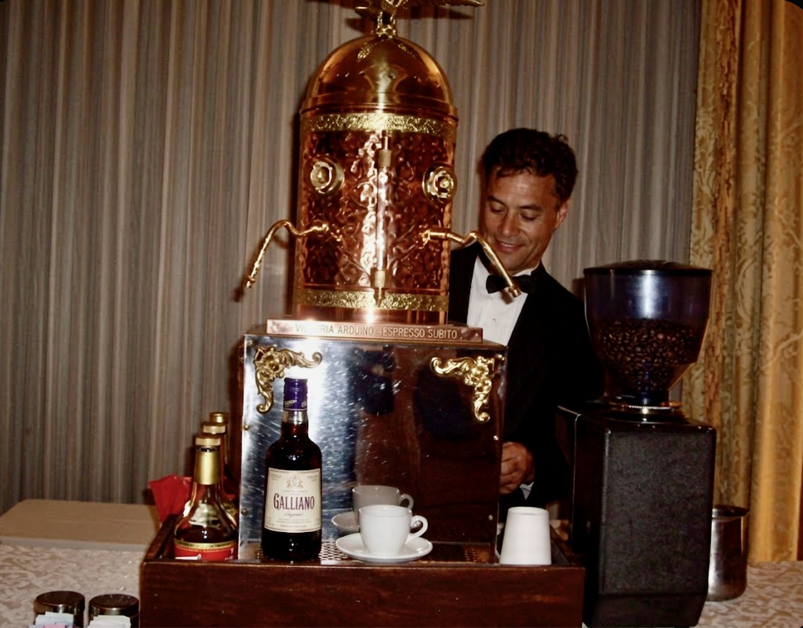 A tuxedoed Espresso Subito barista pulling shots from The Dome at a black-tie event